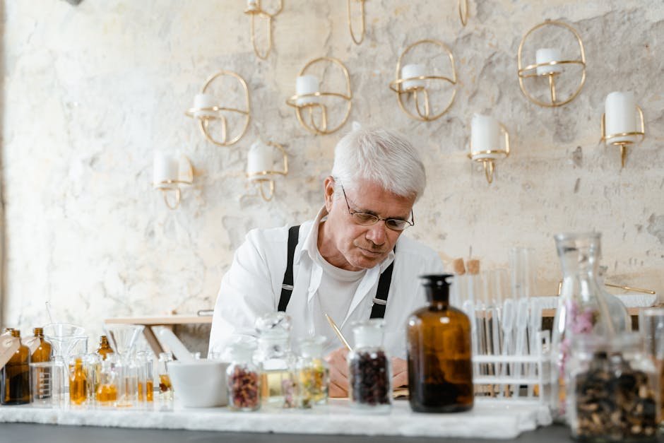 A senior male scientist working with aromatic substances in an indoor laboratory setting.