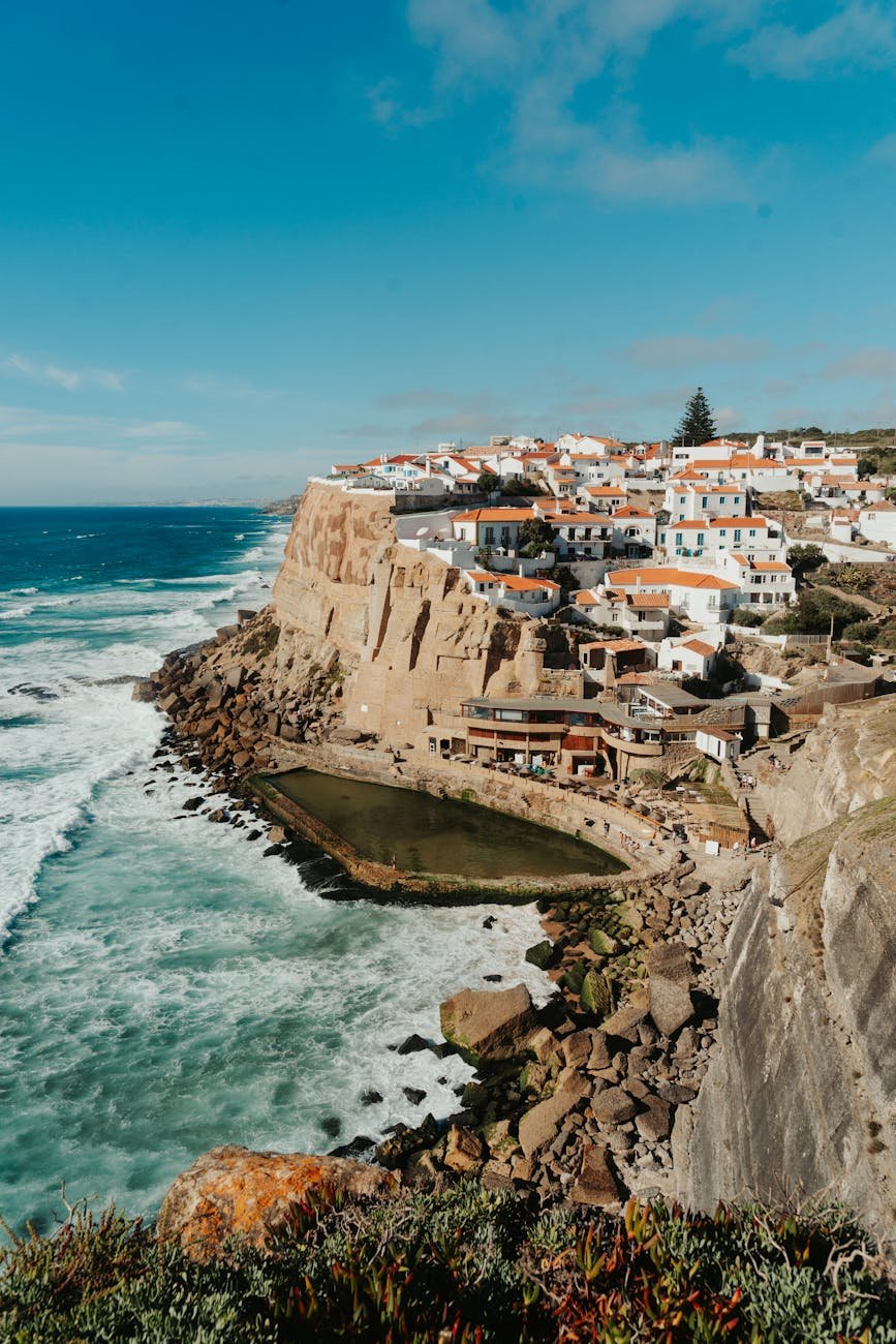 Explore the stunning coastal town of Azenhas do Mar with its dramatic cliffs and ocean views in Portugal.